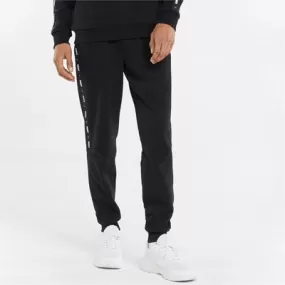 Puma fleece trousers with side band and cuff at the bottom ESS  Tape Sweatpants FL cl 849042 01 black